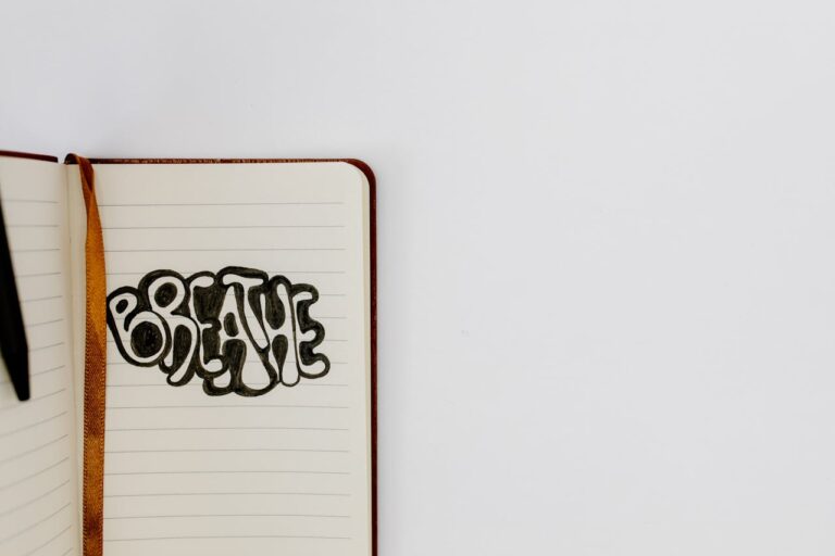 Open notebook with 'Breathe' written in bold letters, offering inspiration and copyspace.